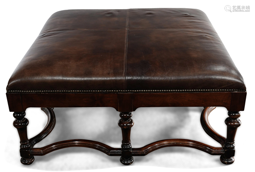 A large leather center ottoman