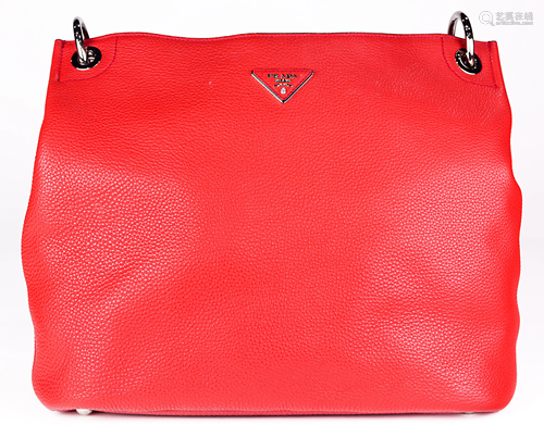 A Prada handbag, executed in red leather with a 7