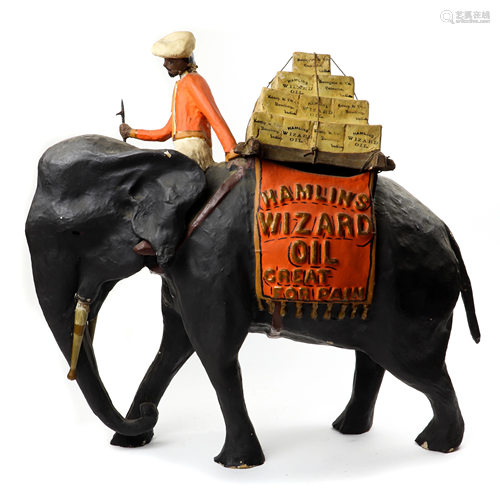 A Hamlin's Wizard Oil paper mache elephant advertising