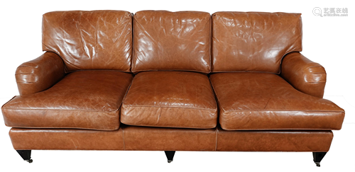 A Coach three seat brown leather sofa