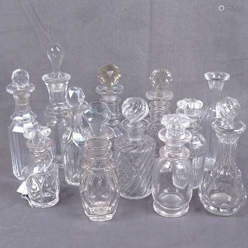A collection of Victorian and other cut-glass scent bottles and stoppers, tallest 20cm