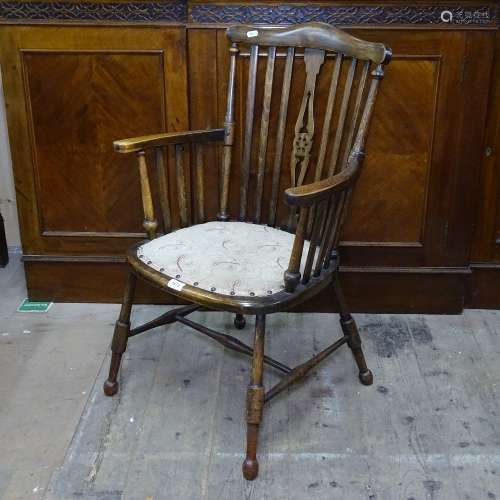 A stained beech wheel-back bow armchair, on turned legs