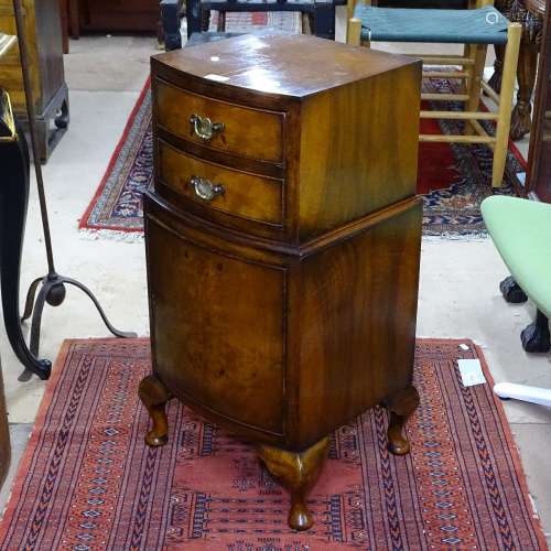 A cross-banded mahogany bow-front bedside cabinet, with 2 short drawers and cupboard under, on