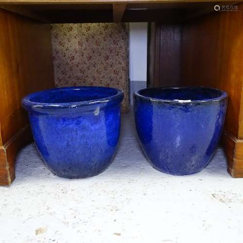 2 similar blue glazed terracotta garden pots