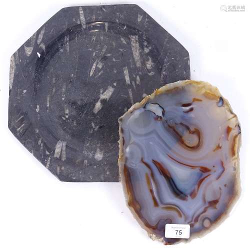 A carved and polished octagonal fossilised panel dish, and a large banded agate geode slice, plate