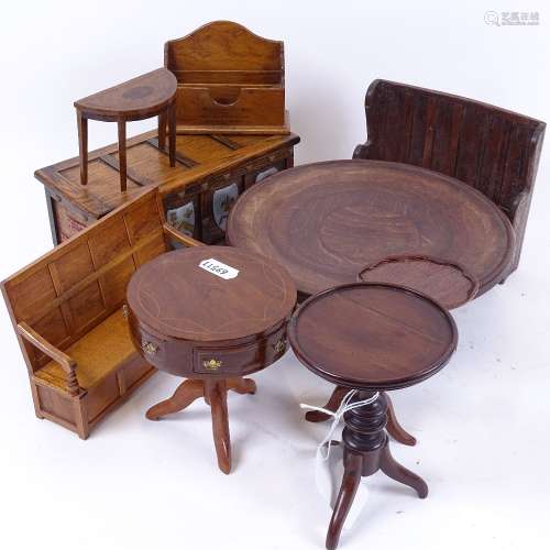 A group of miniature doll's house furniture, including curved oak hall settle, drum-top side