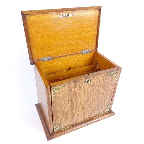 A Victorian light oak travelling stationery cabinet, brass mounts with interior letter rack, pen