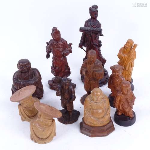A group of Oriental carved hardwood figures, largest height 18cm (11)
