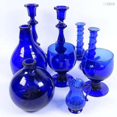 A group of Bristol blue glassware, including candlesticks, rummers, bottles etc (9)