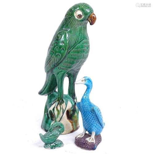 A Chinese green glaze pottery parrot, a turquoise glaze duck, and another, largest height 22cm (3)