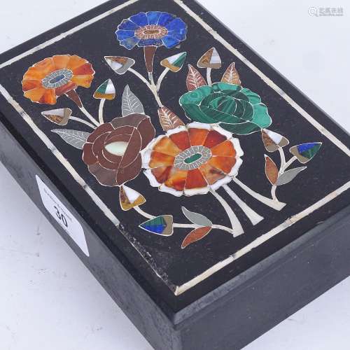A Pietra Dura and black slate dressing table box and cover, floral decorated lid with inset