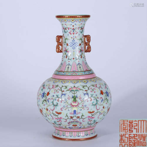 Qing Dynasty Qianlong famille rose double-eared vase with twisted branches and flowers