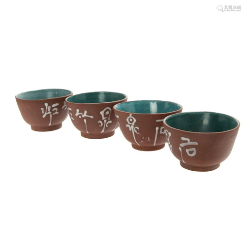 GROUP OF FOUR YIXING TEA CUPS