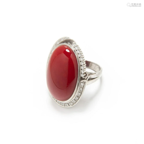 A RARE PLATINUM CORAL DIAMOND RING