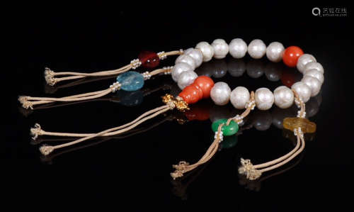 PEARL STRING BRACELET WITH 18 BEADS