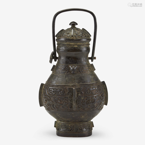 A Chinese patinated bronze archaistic vessel and cover,