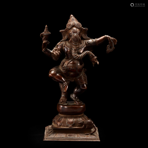 An Indian silver-inlaid bronze figure of Ganesh,