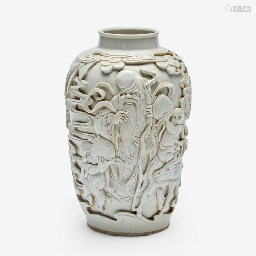 A Chinese deeply-carved porcelain 