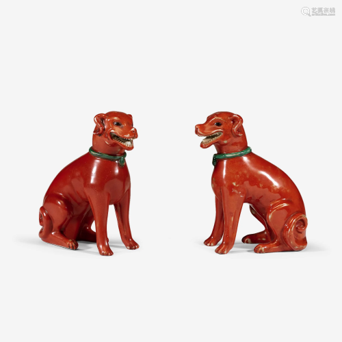A pair of Chinese iron-red glazed porcelain figures of