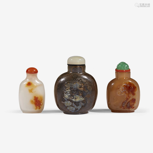 Three Chinese carved hardstone snuff bottles,