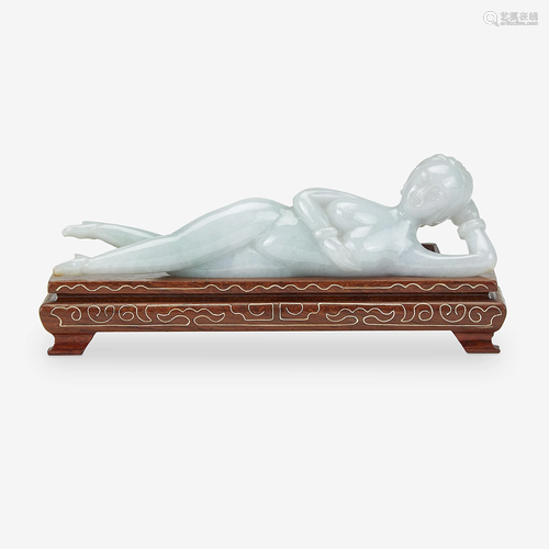 A Chinese carved jadeite figure of a reclining female