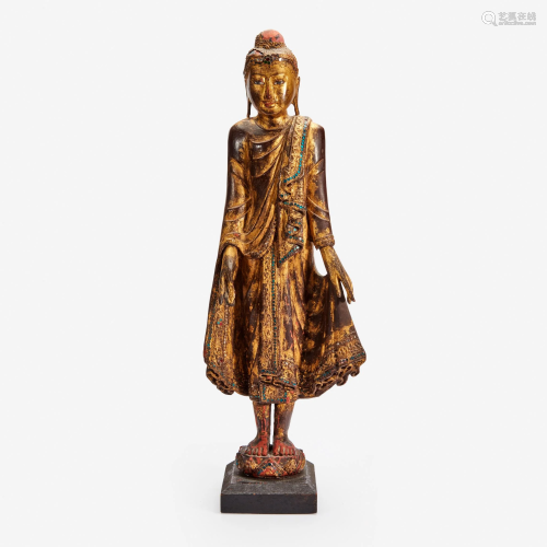 A Burmese gilt lacquered figure of a standing Buddha,