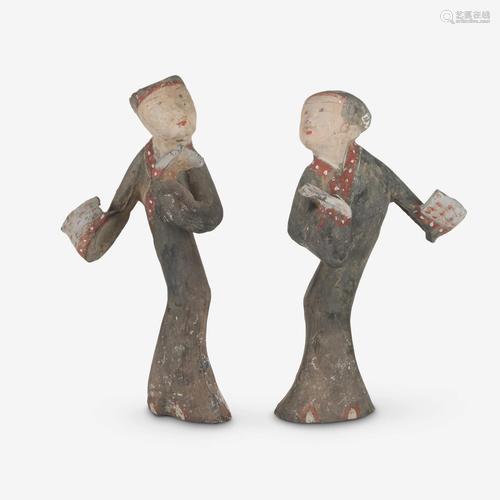 A pair of Chinese painted grey pottery figures of