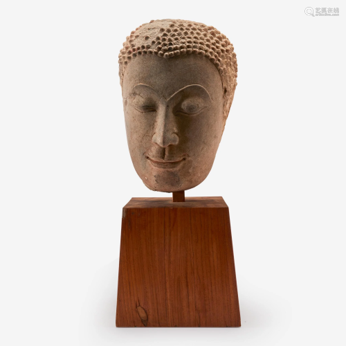 A Thai carved sandstone head of Buddha, 15th-17th
