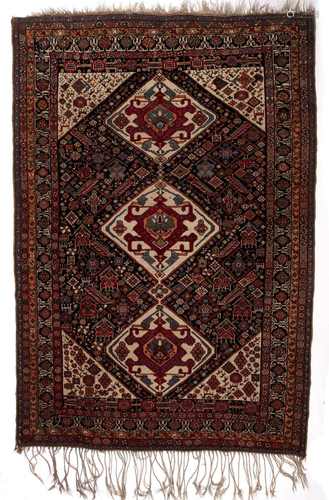 Qashqai blue ground tribal rug with three central medallions and further stylised foliate animal and