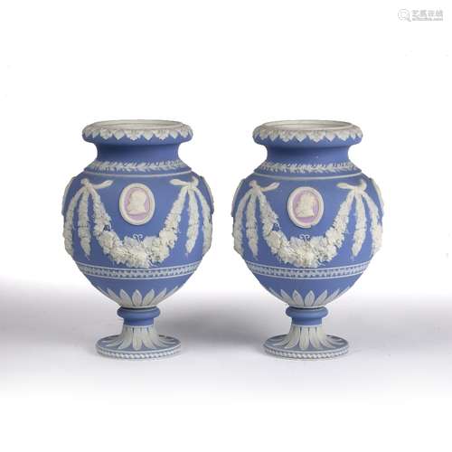 Pair of Adams jasperware urns circa 1830, decorated with pink cameos around the body with foliate