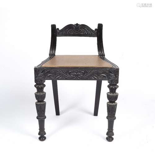 Anglo/ Indian ebony low chair 19th Century, carved to the back and on the front supports, 49cm