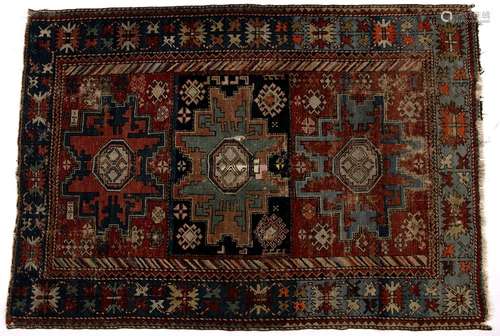 Caucasian polychrome rug with three stylised geometric panels and blue border, 156cm x 107cm