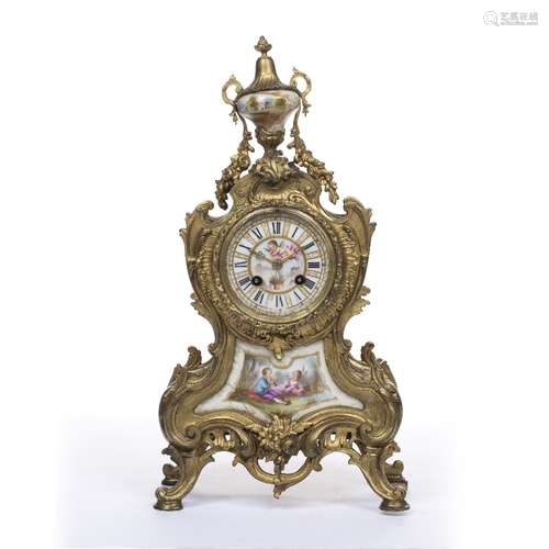 Gilt metal mantel clock, French, late 19th Century inset with porcelain panels, and having a