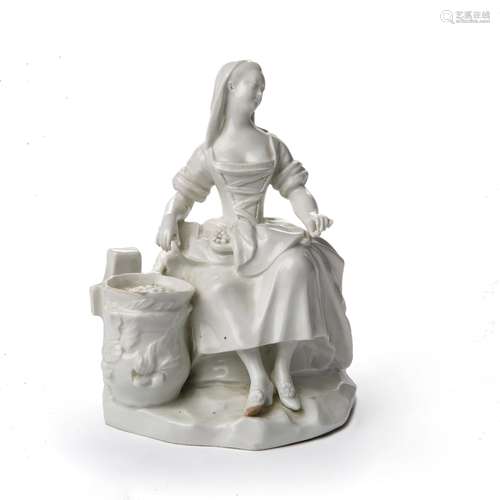 Vienna porcelain white figure of a cook 18th Century, circa 1770, seated by a saucepan on a