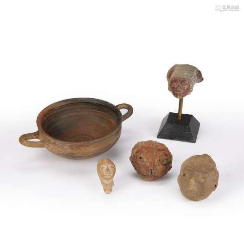 Group of antiquities Roman and Egyptian including a mounted pottery head, 12cm high (inc stand), a