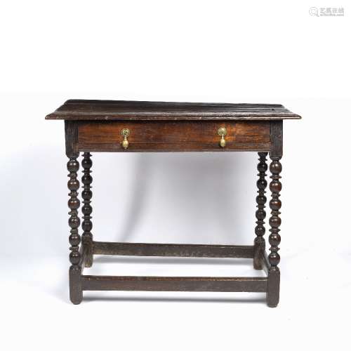 Oak side table 17th/18th century, with bobbin turned supports and a single drawer to the front, 70cm