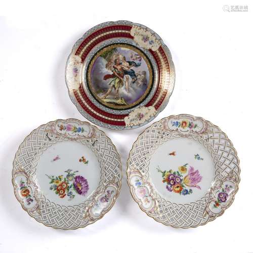 Pair of Meissen plates decorated with flowers and insects to the centre surrounded by an openwork