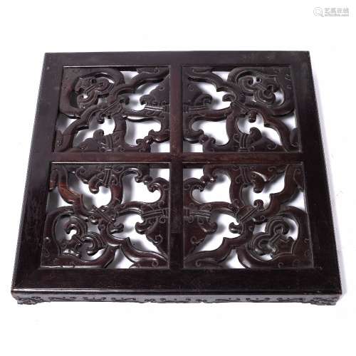 Hardwood low stand Chinese, with four carved panels to the top, possibly Zitan, 63cm across, 7.5cm