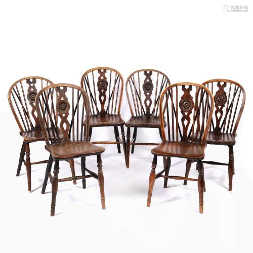 Near set of six 'Oxford' elm and ash wheel-back chairs with stretcher supports, one stamped to the