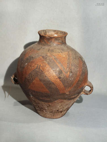 A Chinese Neolithic painted pottery storage jar, decorated with zig-zag lines in black and ochre