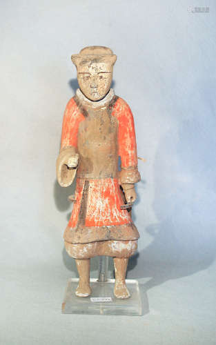 A Chinese painted pottery standing figure of a guard or attendant, perhaps Han Dynasty, 44.5cm