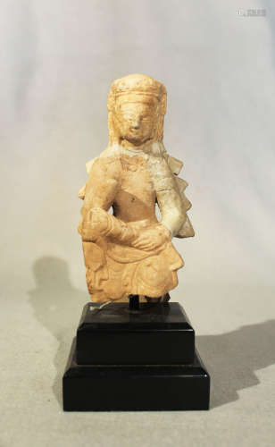 A Chinese white marble seated Guanyin, in 6th/7th Century style, with rudimentary repair, 14.5cm