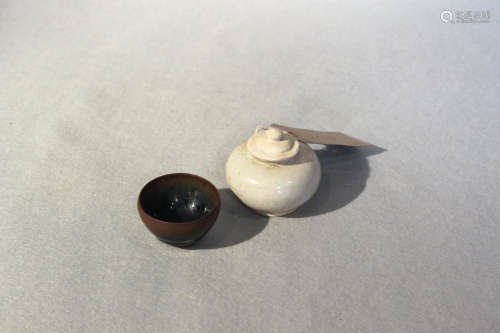 A Chinese Henan type small tea bowl, Song Dynasty, 7cm high and a small white glazed cosmetic jar,