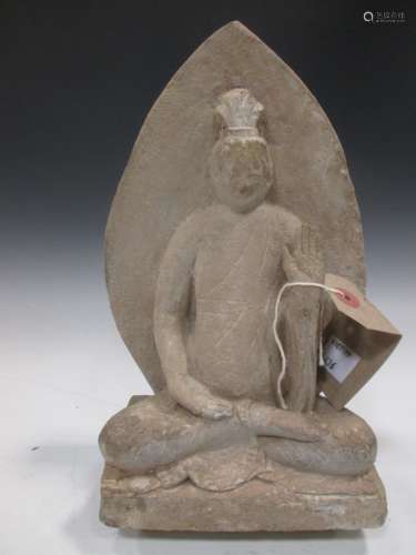 A Chinese greystone figure of a Buddha, in late Wei/Sui Dynasty style, seated in meditation, C6/