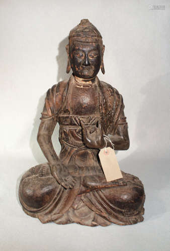 A Chinese carved wood seated figure of a Buddha, in Song Dynasty style