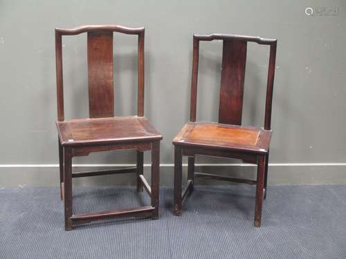 Two Chinese hardwood yoke-back chairs, in Ming style, with solid seats and curved splats, 105cms