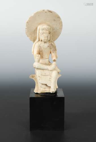 A Chinese white marble seated figure of Avalokiteshvara with aureole, in 6th/7th century Style, 24.