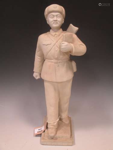 A Chinese white unglazed porcelain figure of a Maoist soldier, mid/late 20th century, impressed