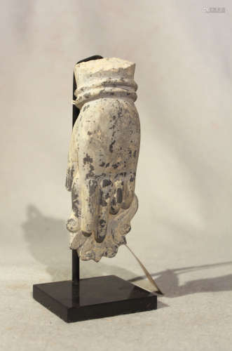 A Chinese grey stone fragment of a hand clutching flowers, in Tang/Song Dynasty style,15cm high