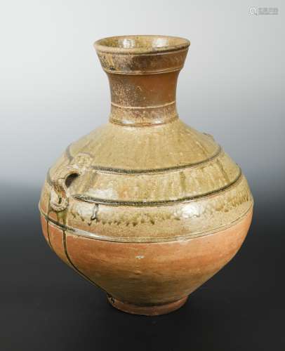 A Chinese olive glazed pottery vase, hu, mask lugs, probably Han Dynasty, 46.5cm high